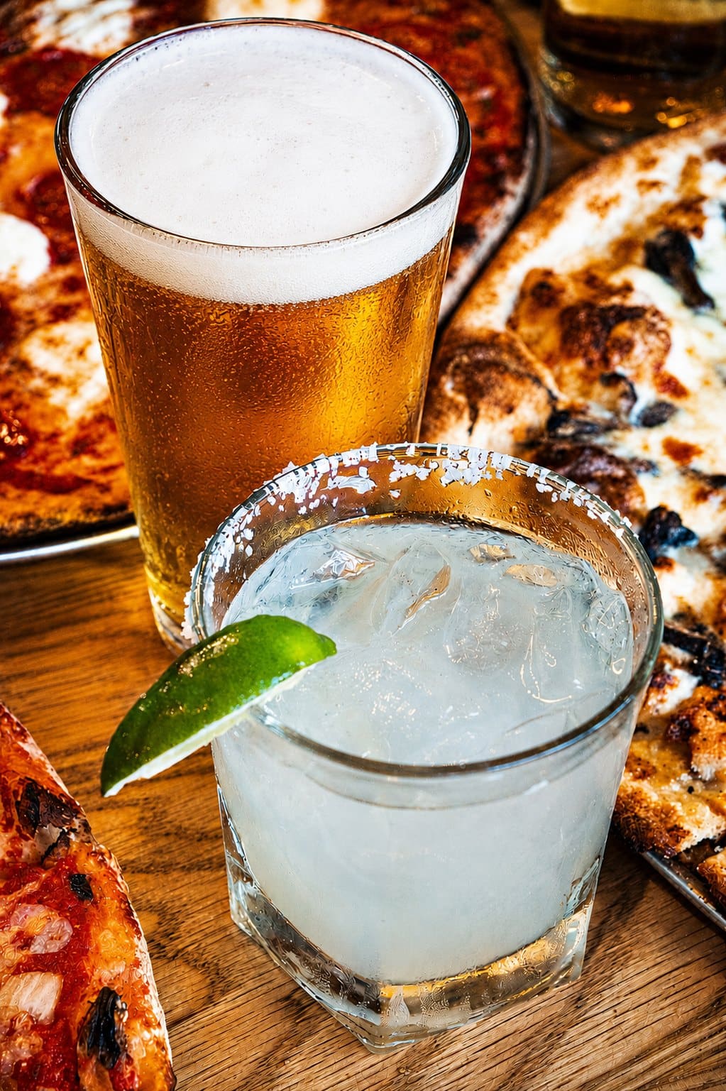 A cold beer and a margarita on the table