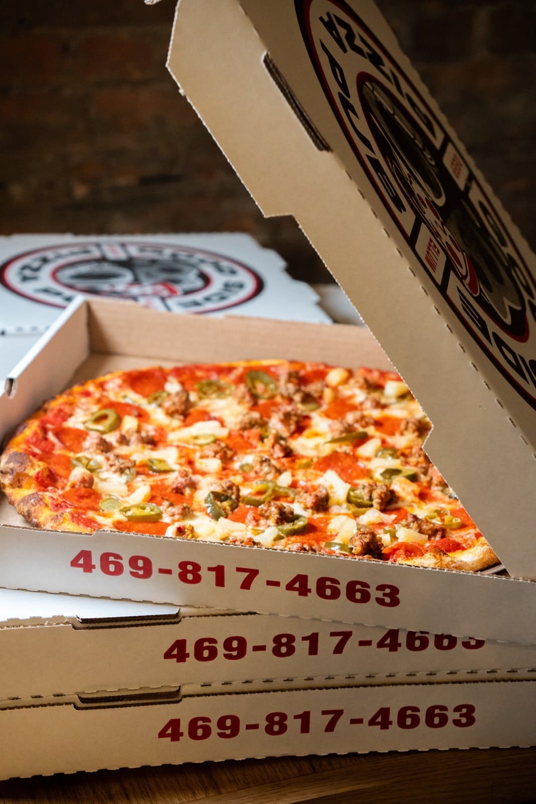 Boxed Good Side pies stacked for an order