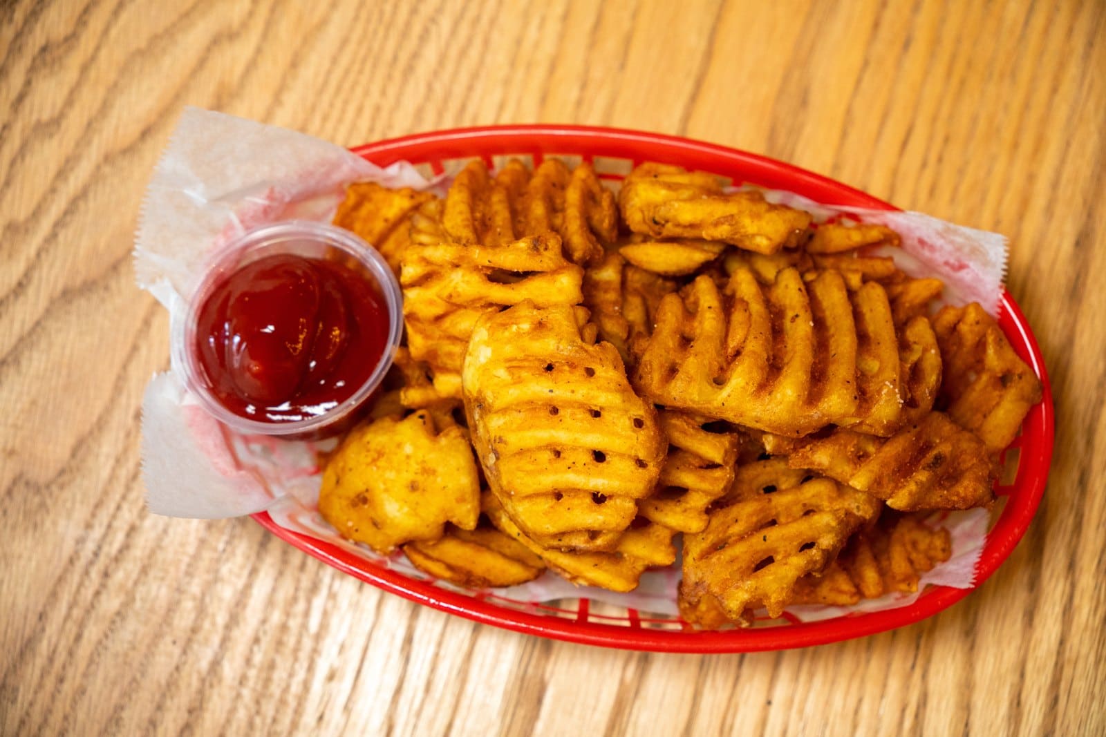 Waffle fries with ketchup
