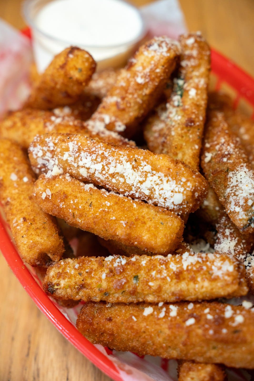 Fried cheese sticks dusted with parmesan